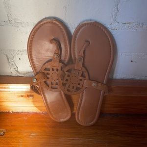Tan flip flops